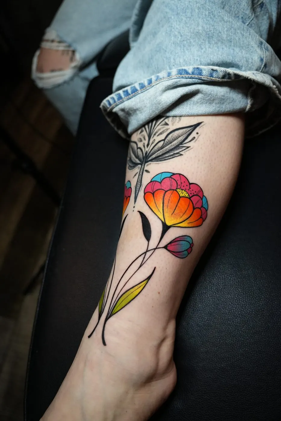Colour watercolour tulip tattoo on a forearm
